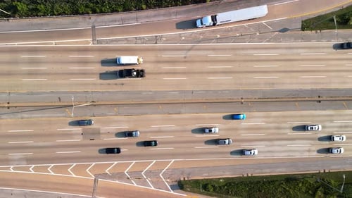 Highway Road with the Fastmoving Vehicles Trucks Showing US Transportation Infrastructure Under a
