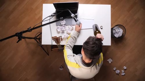 Writer's Block Frustration with Wine Bottle