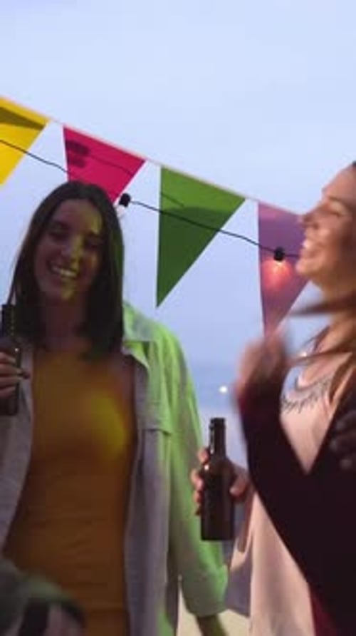 Group of Multiracial Friends in a Terrace Dancing and Having Fun Together