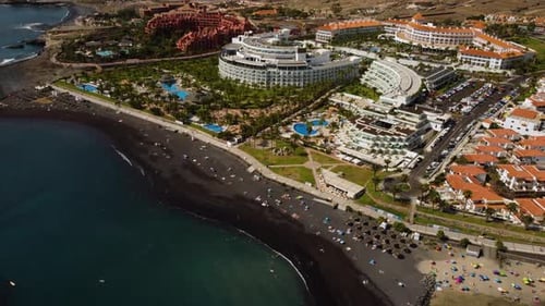Beautiful Seaside Volcanic Black Beach Seashore Buildings Hotels Pools Drone Shot Tenerife in Spain