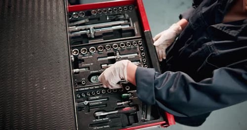 Above mechanic, toolbox and hands with tools in garage for maintenance, repair service