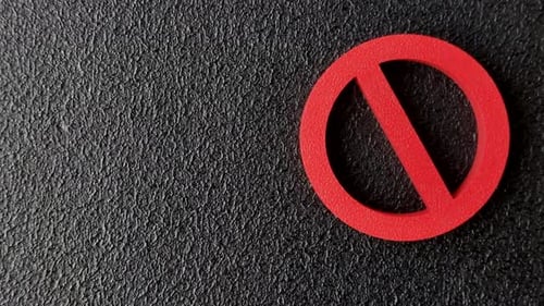 A prohibition or ban sign as a warning to stop, about rules, or about danger. A prohibition sign