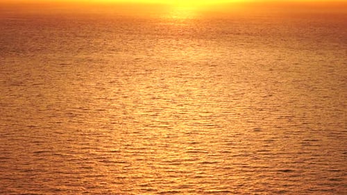 Sea Water Surface Aerial View on Golden Sea Water at Sunset Sun Glare Abstract Nautical Summer Ocean