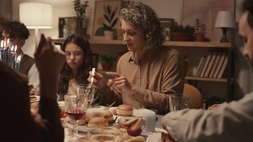 Family Gathering for Hanukkah Celebration Meal at Home