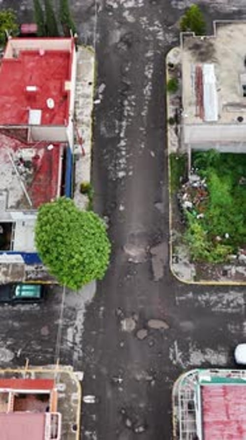 Flying low over broken streets in Ecatepec, Mexico. Vertical mode