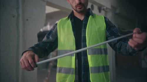 Serious Caucasian Male Contractor Inspector Man Holding Ruler Architect Using Tool Measuring Tape