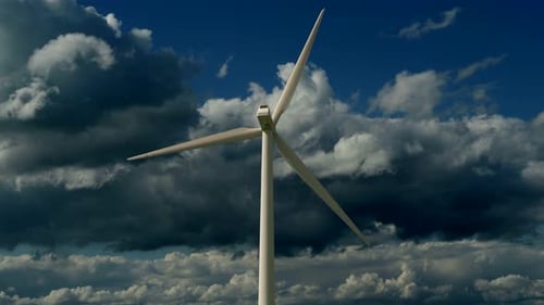 Wind Turbine Stands Tall Under Dramatic Sky Harnessing Renewable Energy for a Sustainable Future