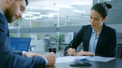 In the Office Businesswoman and Businessman Have Conversation, Negotiating, Draw up a Contract, Sig