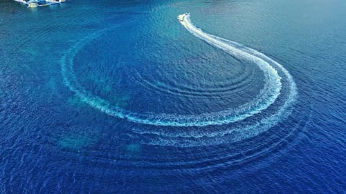 Motor Boats Float on the Sea Surface Creating a Pattern Against the Background of Clear Sky