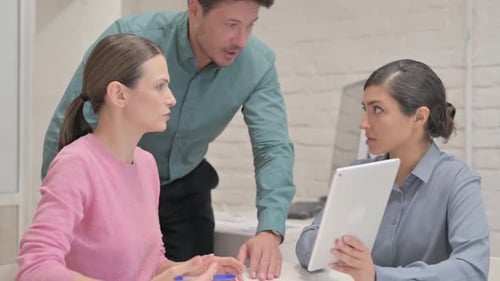 Team Collaboration: Business Meeting with Tablet Device