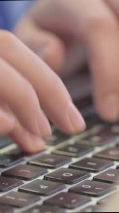 Close up of Female Hand Typing on Laptop, Vertical Video