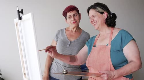 Women Painting Together in an Art Studio