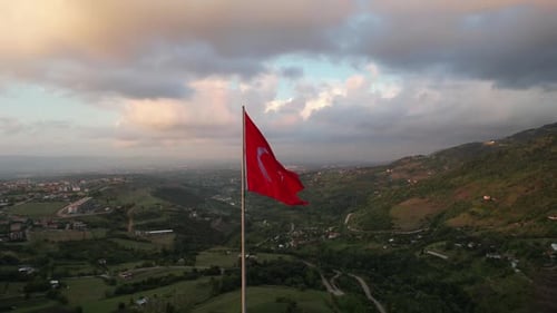 Turkish Flag Waving Proudly Over Rural Landscape