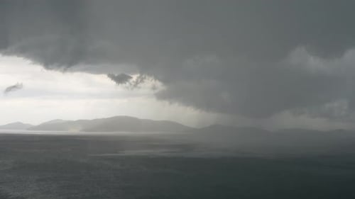 Storm moving above island. Heavy rain. Time Lapse
