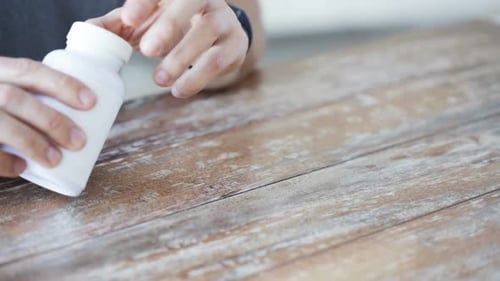 Sport, Healthy Lifestyle, Medicine, Nutritional Supplements and People Concept - Close Up