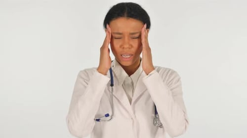 Woman Doctor Experiencing Headache in White Room