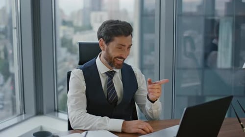 Worker Speaking Virtual Meeting with Colleagues Remotely Sitting Modern Office