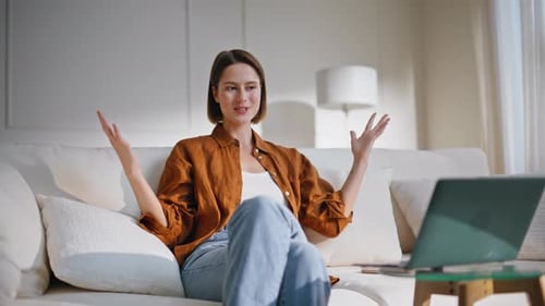 Woman on Couch Talking on Video Call