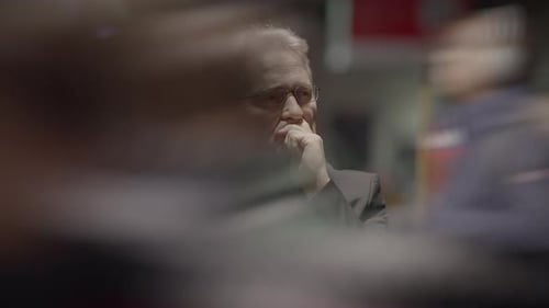 Adult in Suit Contemplating at Night