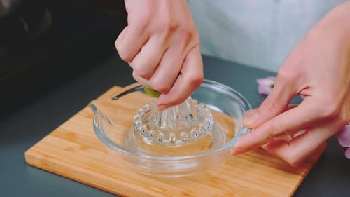 Squeezing Lime Juice with a Manual Juicer