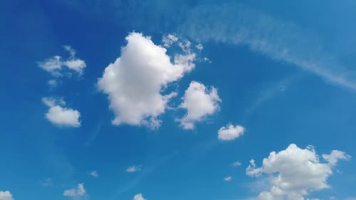 Clouds Floating in a Bright Blue Sky