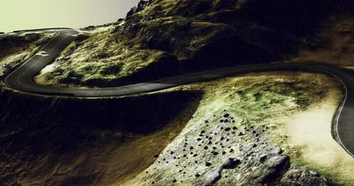 Winding Road Traverses Rugged Terrain at Twilight Under a Dramatic Sky