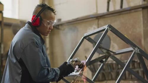 Woman Polishing Metal after Welding