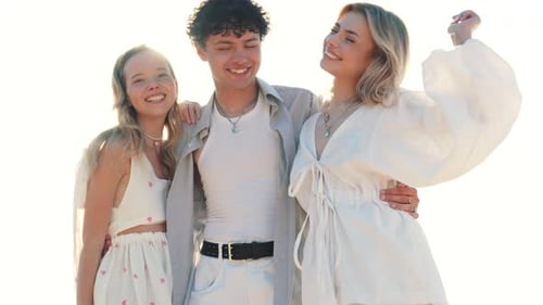 Man and two women at seaside