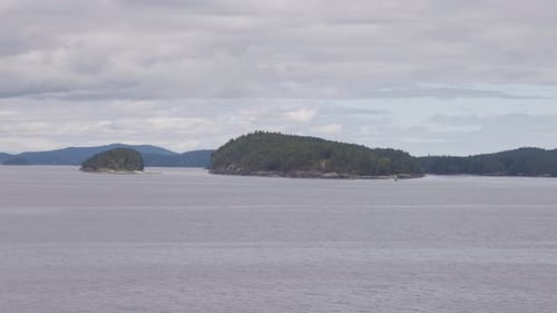 Islands Surrounded By Ocean and Mountains