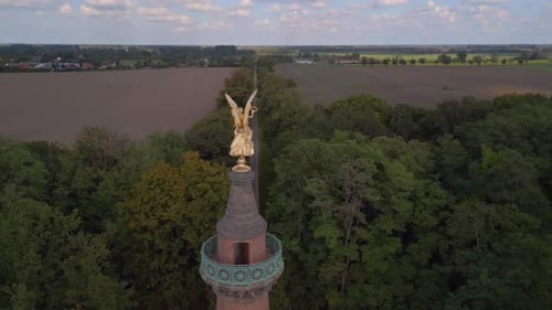 golden angel figure symmetrically in the middle.
Spectacular aerial view flight point of view POV dr