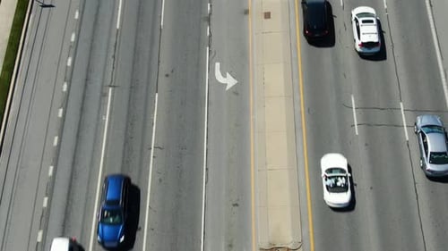Aerial above busy multilane highway, holiday travel, stop and go traffic during busy commute