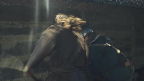 Warriors are Fighting during Attack on Village. Medieval Reenactment.