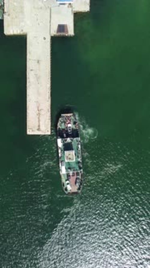 Ferry Carrying Cars and Passengers Across the Sea Top Down Aerial Drone View Aerial Vertical View on