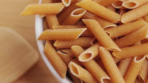 Bowl of delicious dry whole wheat pasta