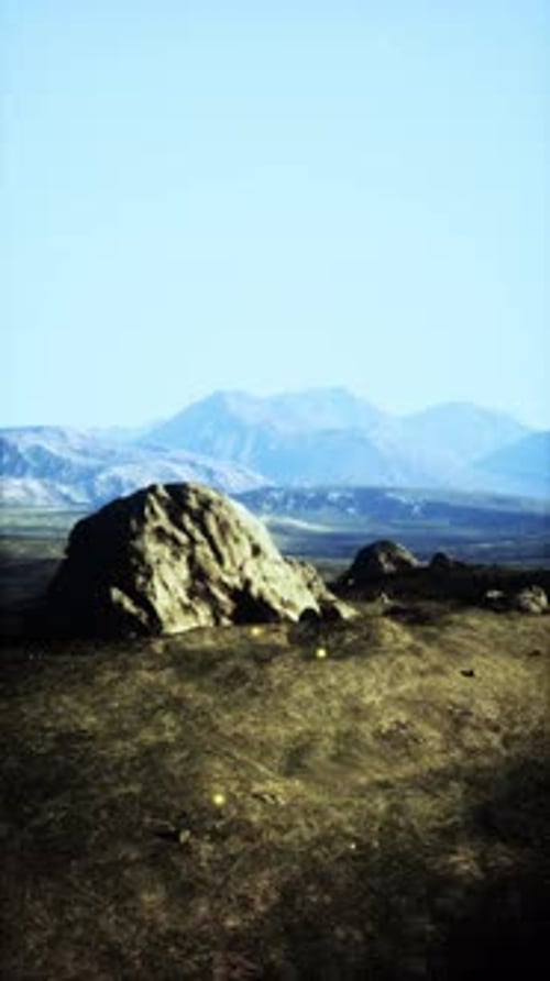 Large Rock on Grass Field
