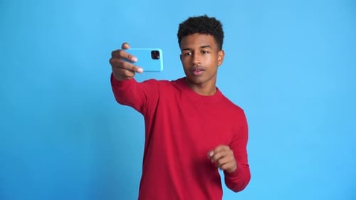 Young Adult Using Smartphone for Selfie