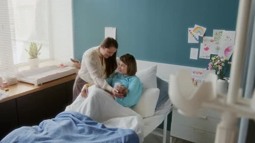 Woman Visiting Daughter and Newborn Baby in Hospital