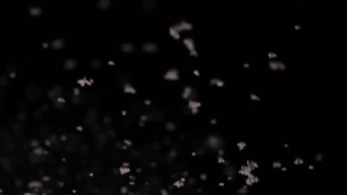 Snow Falling Upward on Black Background