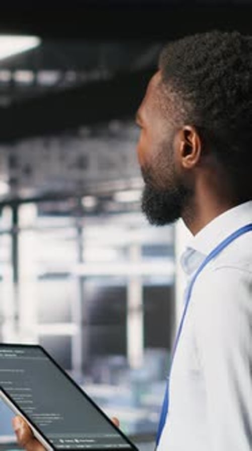 Vertical Video Data Center Programmer Checking Lines of Code Next to Colleague