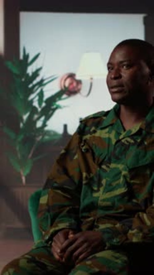 Soldier in Camouflage Uniform Speaking