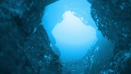 Water vortex swirling making a hole. Abstract background with liquid drops. 3d loop animation 4k