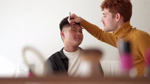 Young Adults Applying Makeup Together at Home