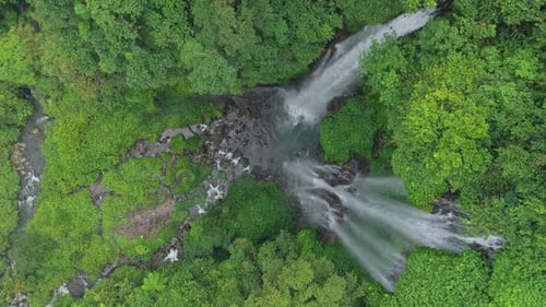 Aerial View of Tropical Waterfall in Lush Greenery