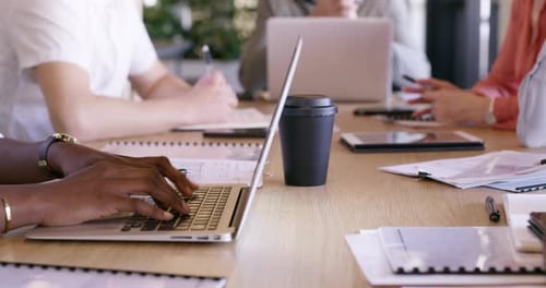 Hands, technology or meeting at table in coworking office, working or discussion for collaboration