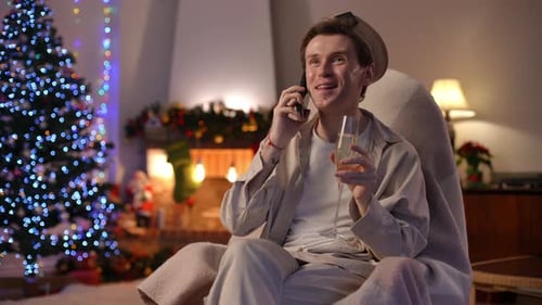 Man Relaxing at Christmas Talking on Phone