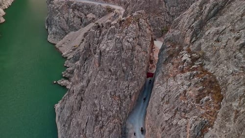 Motorcycle Convoy in Narrow Rock Pass in Karanlik Canyon, Kemaliye, Turkey