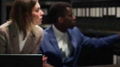 Adults Working Together with Technology in Office