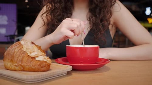 Female Hands Stirring Coffee