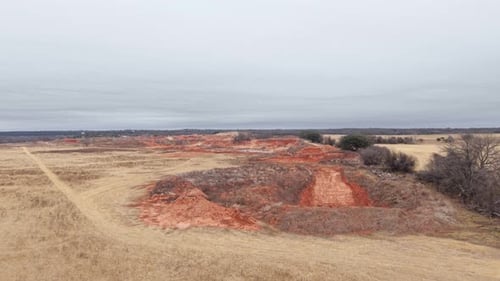 Aerial view of eroded red soil in open landscape