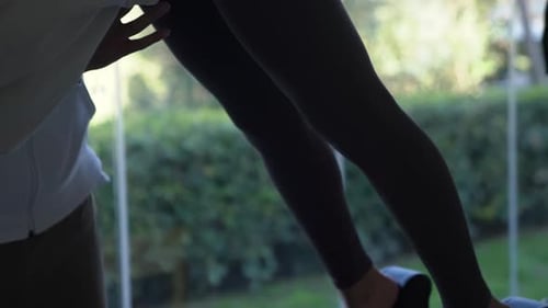 Girl Doing Exercise on Simulator in Gym